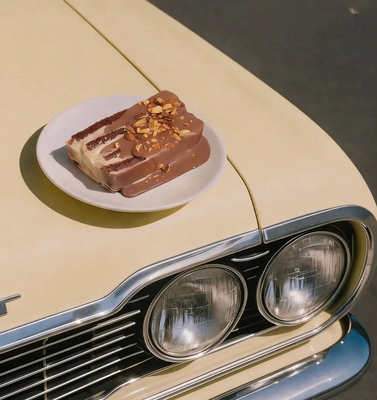 Chocolate cake on a vintage car